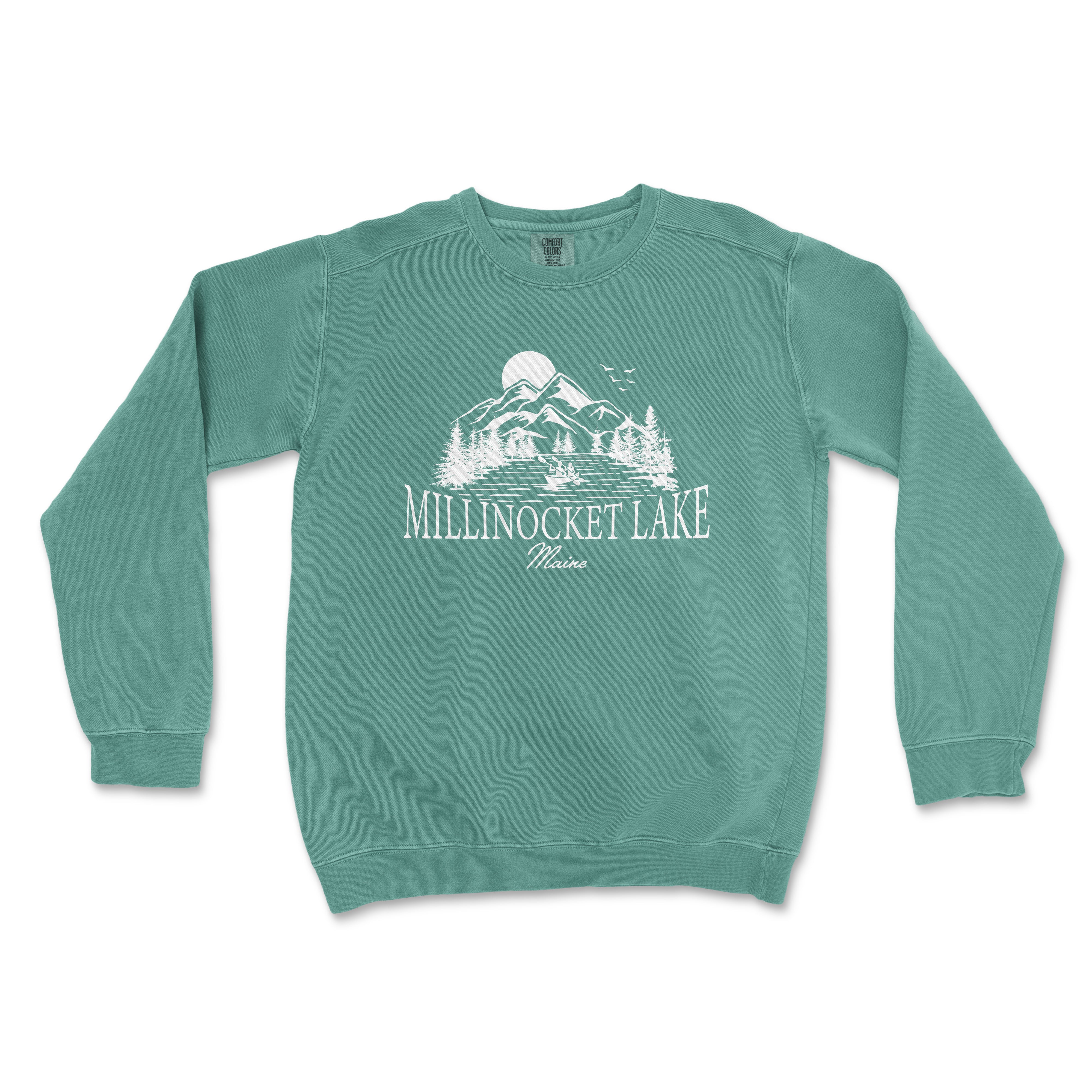 a mint green sweatshirt with a mountain scene on it