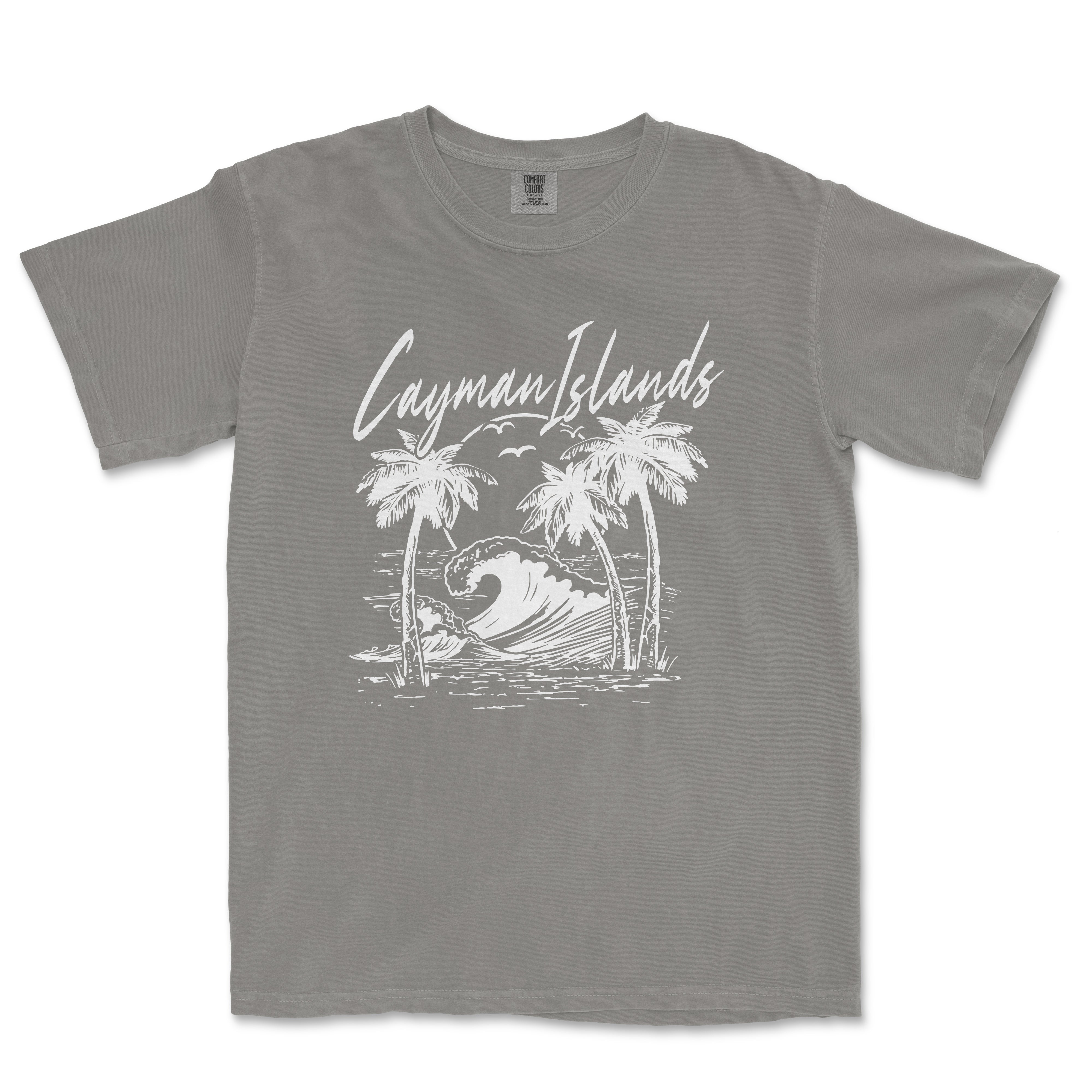 a gray t - shirt with a picture of a surfboarder riding a wave