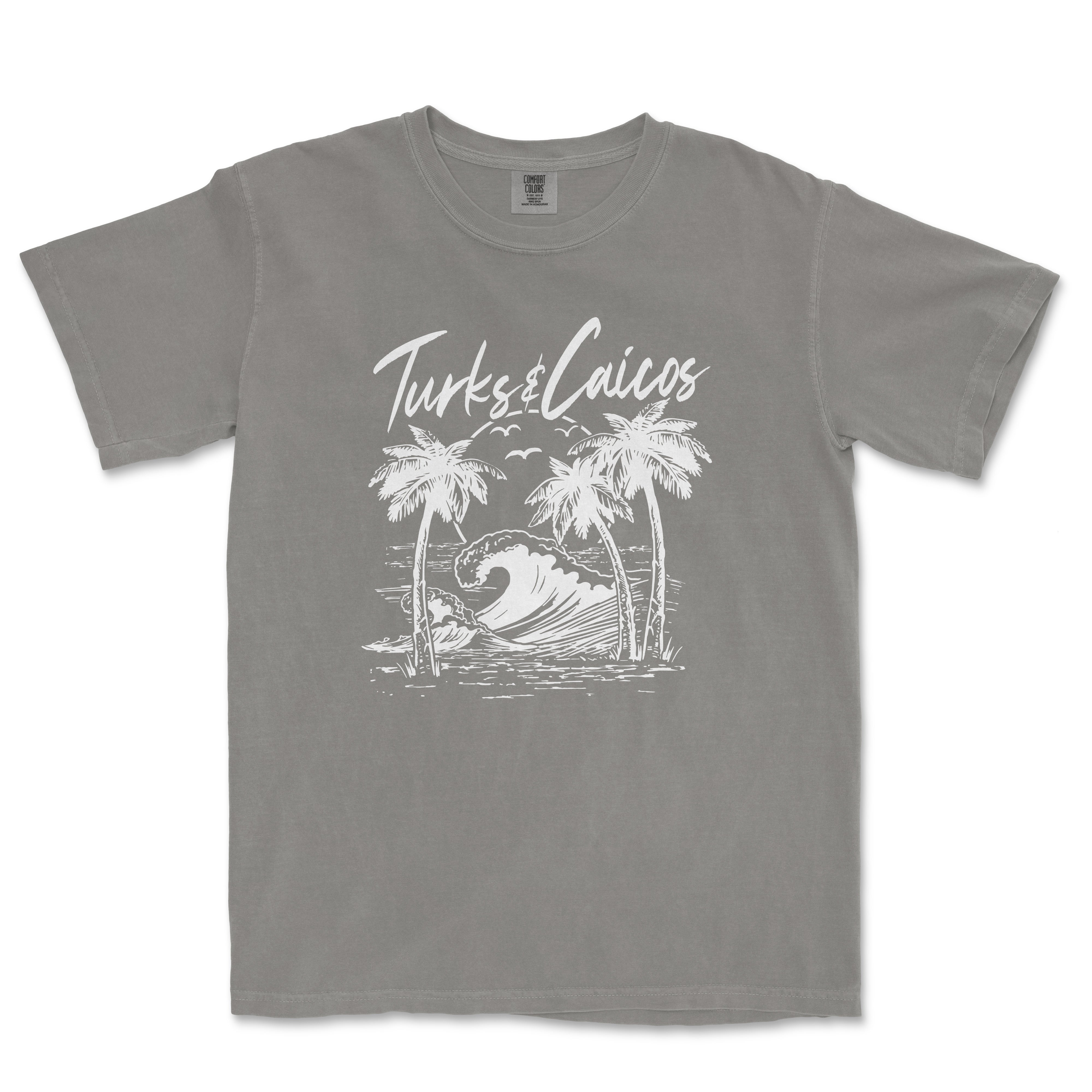 a grey t - shirt with a picture of a wave and palm trees