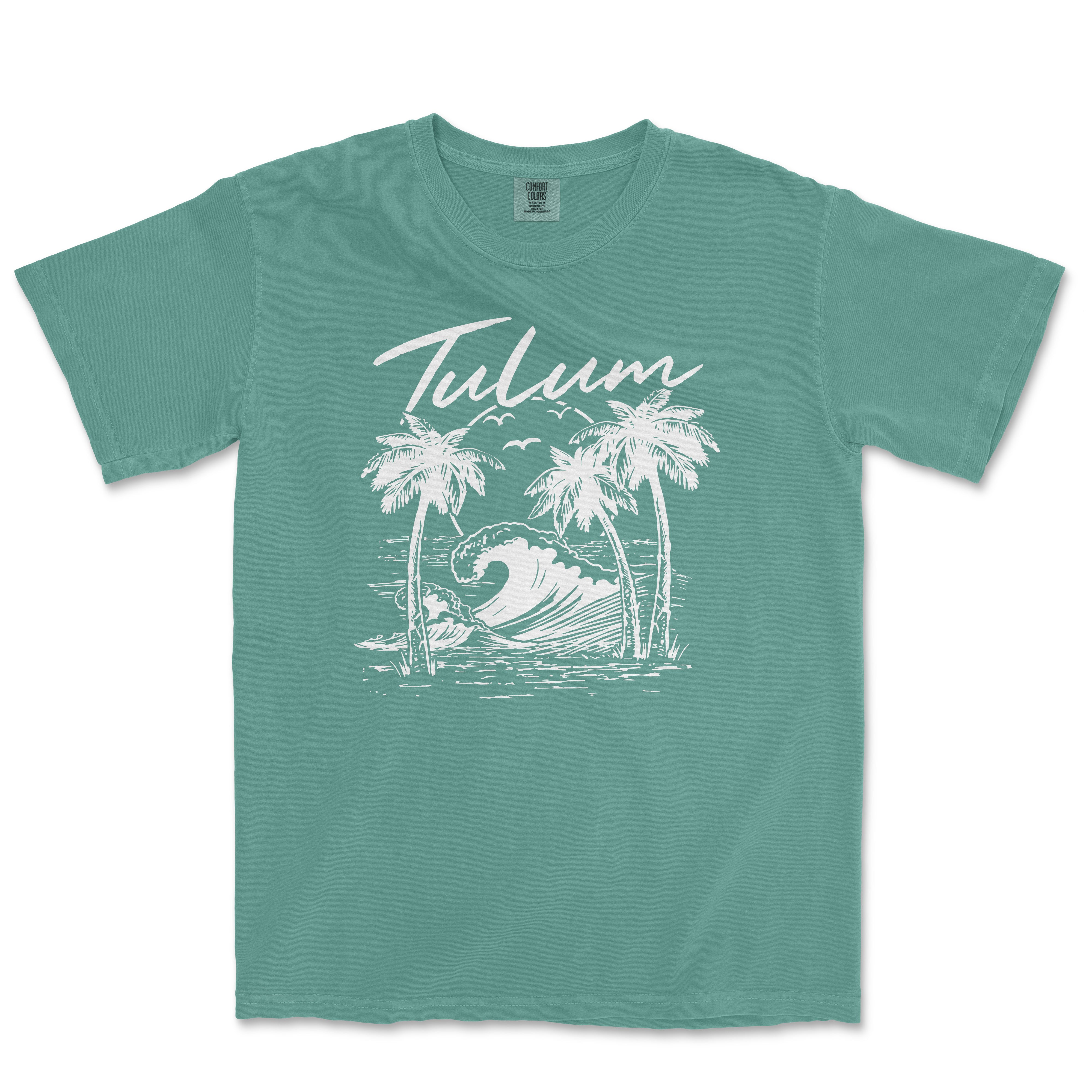 a green t - shirt with a picture of a wave and palm trees