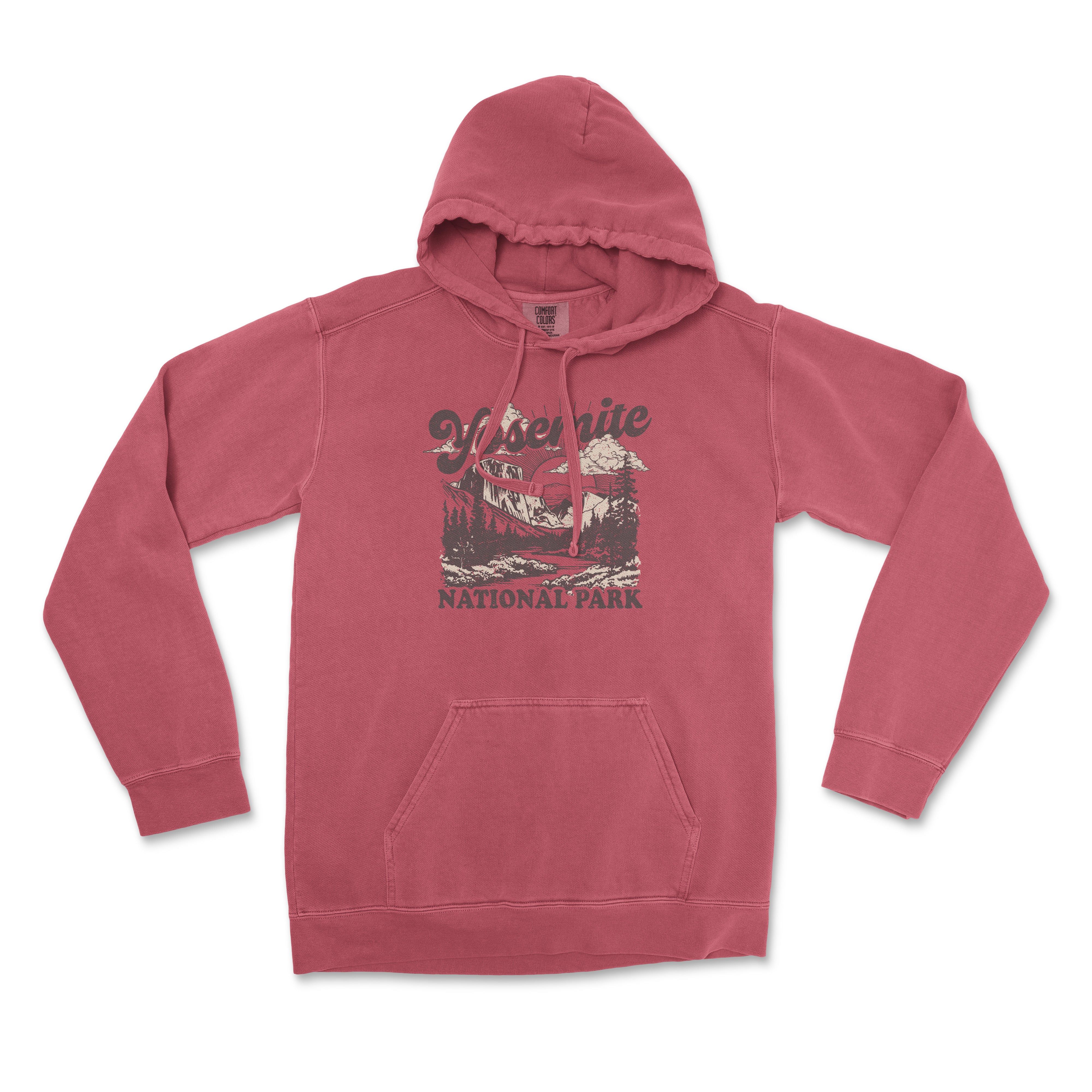 a pink hoodie with a picture of a lake and mountains