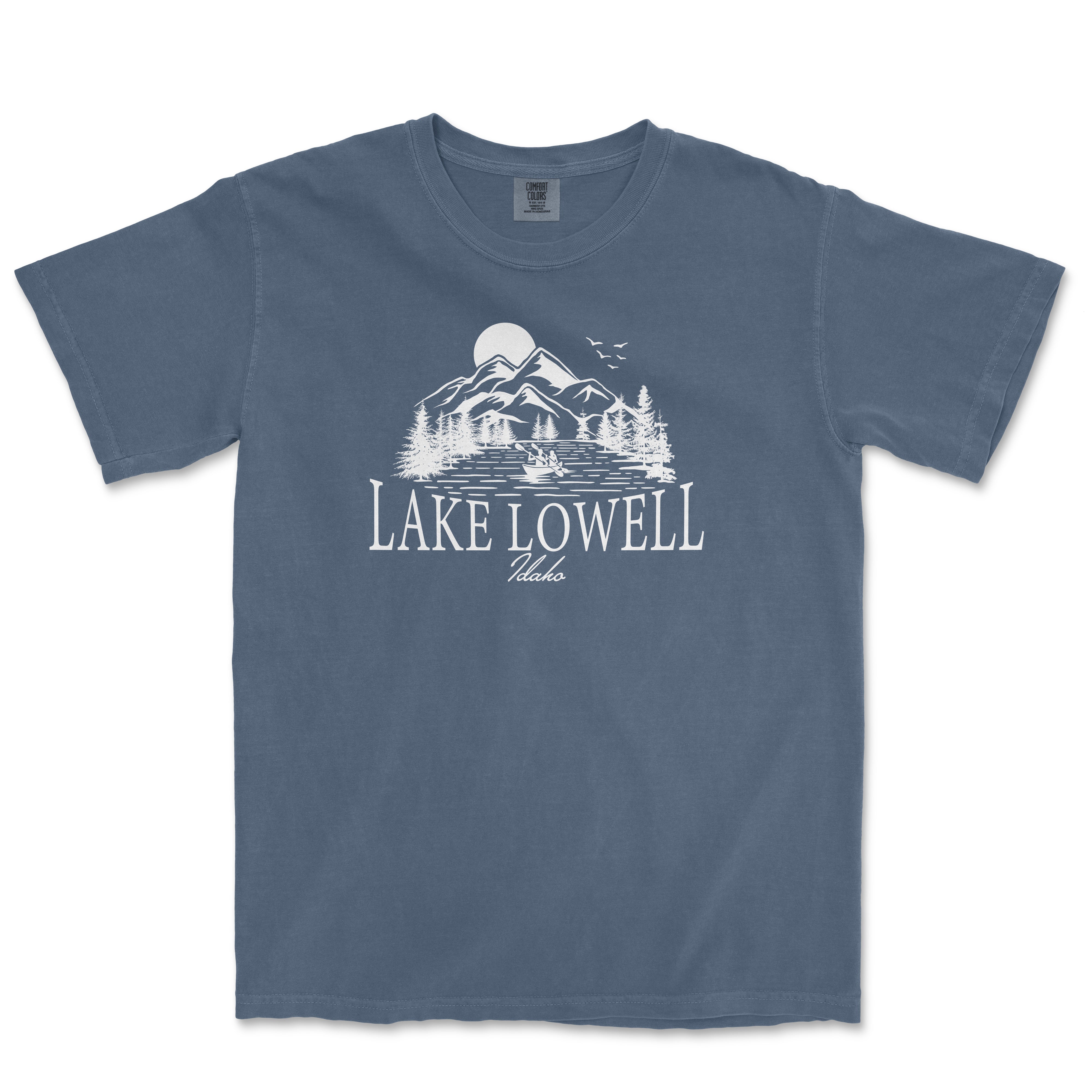 a blue lake towel t - shirt with a mountain scene