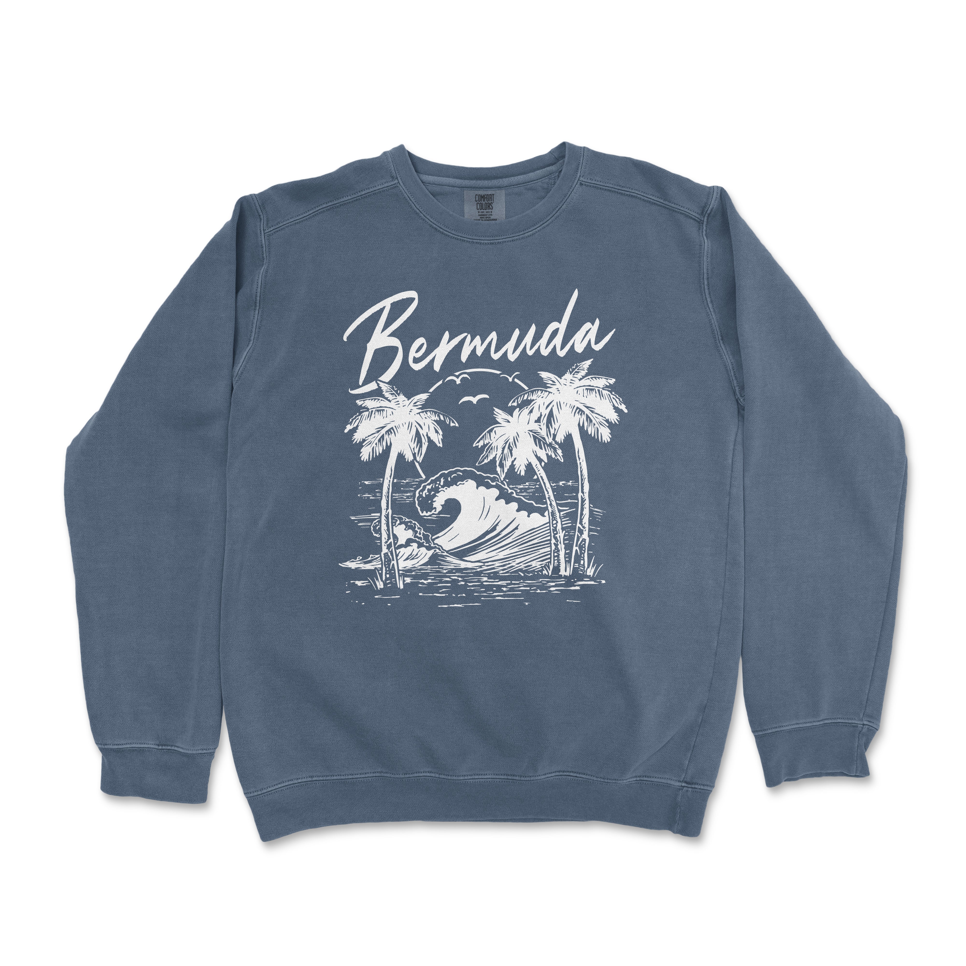 a blue sweatshirt with a picture of a wave and palm trees