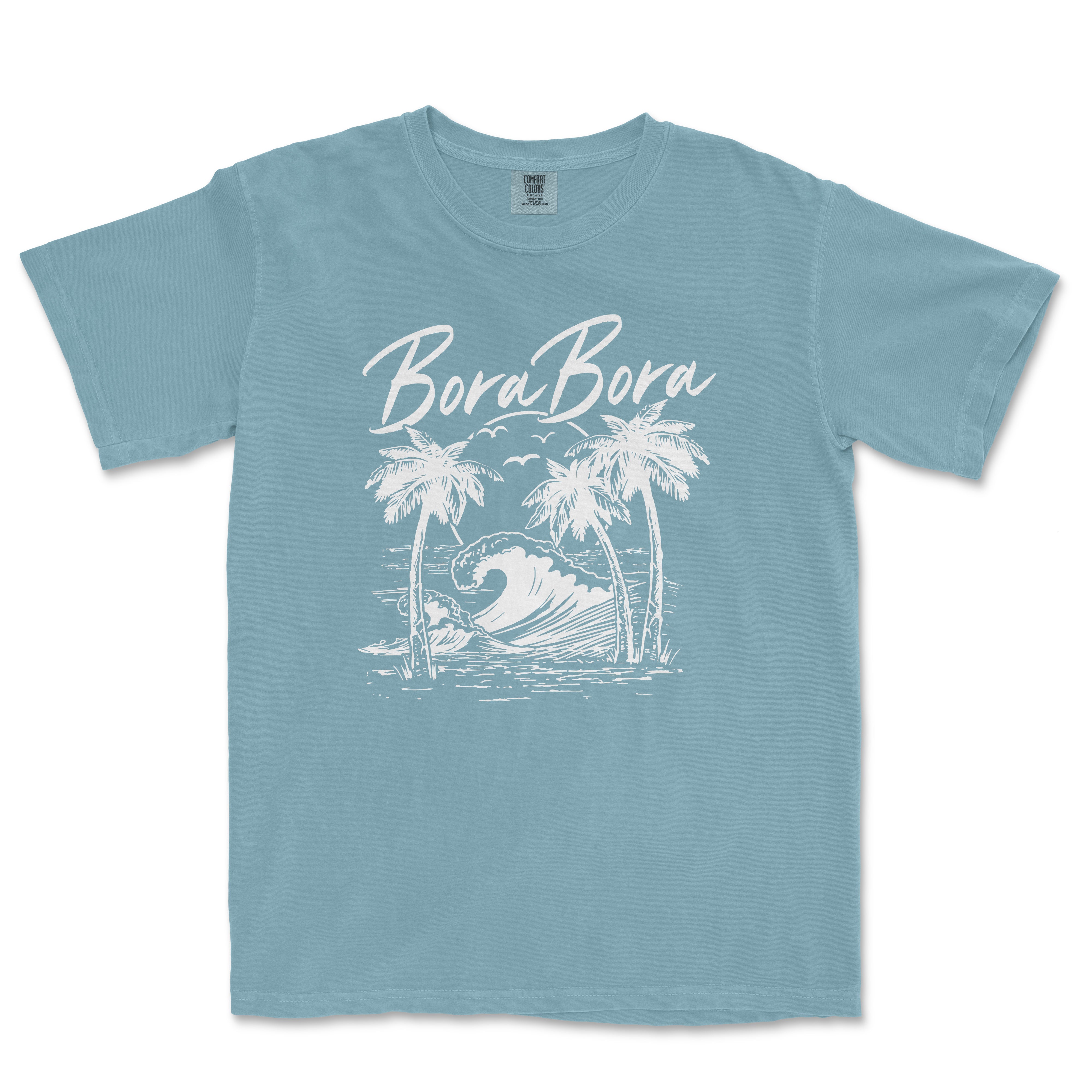 a blue t - shirt with a picture of a wave and palm trees