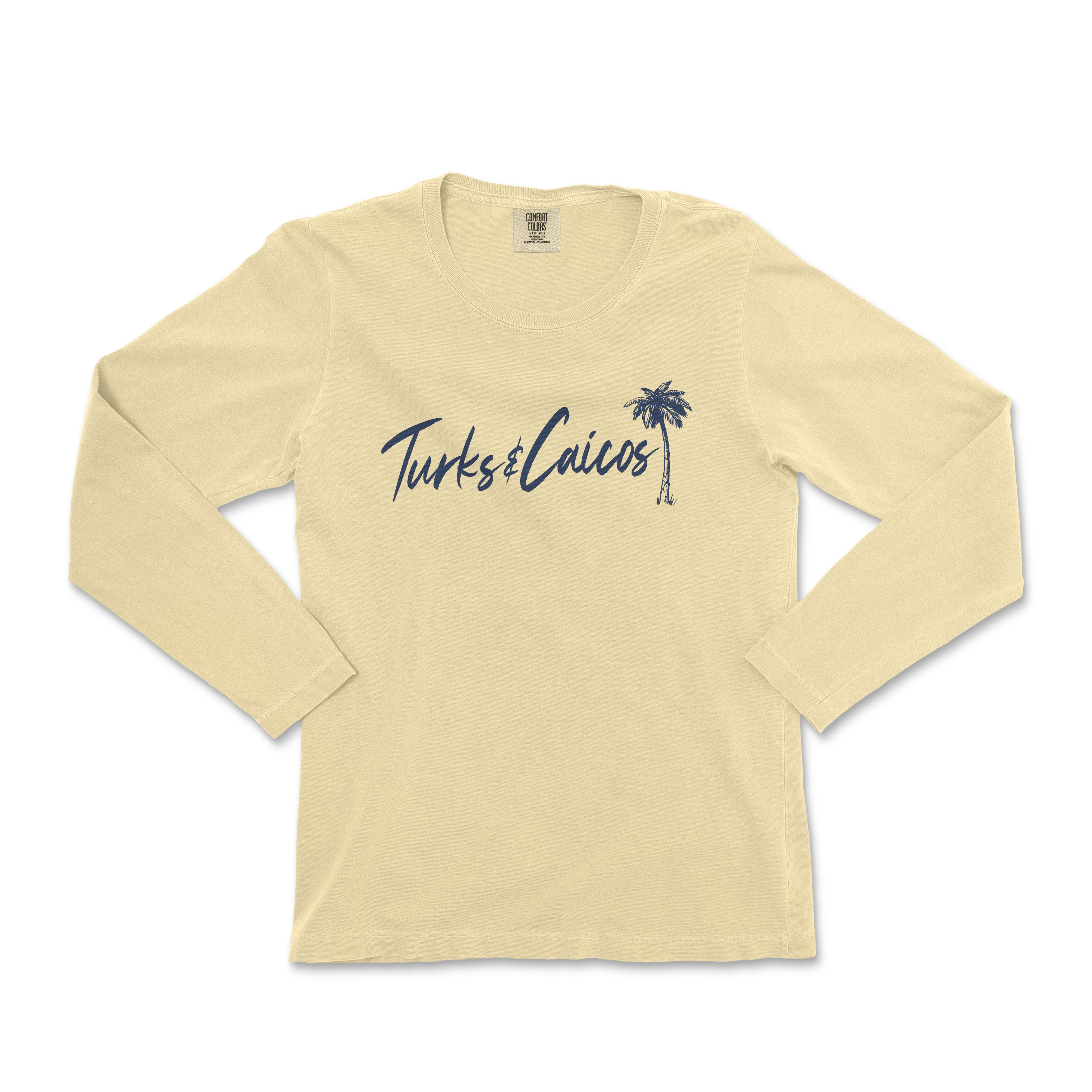 a women's long sleeve shirt with a palm tree on the front