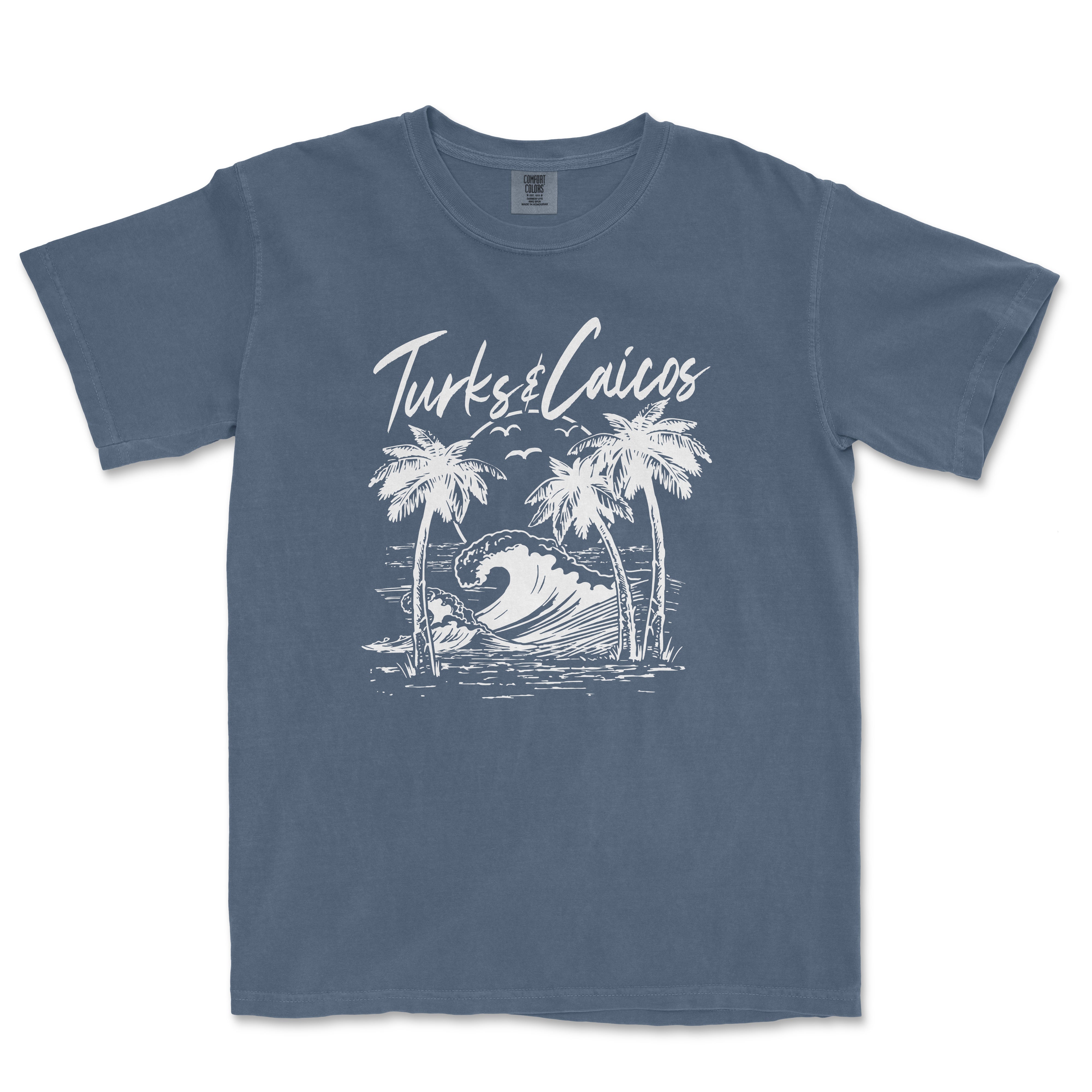 a blue t - shirt with a picture of a wave and palm trees