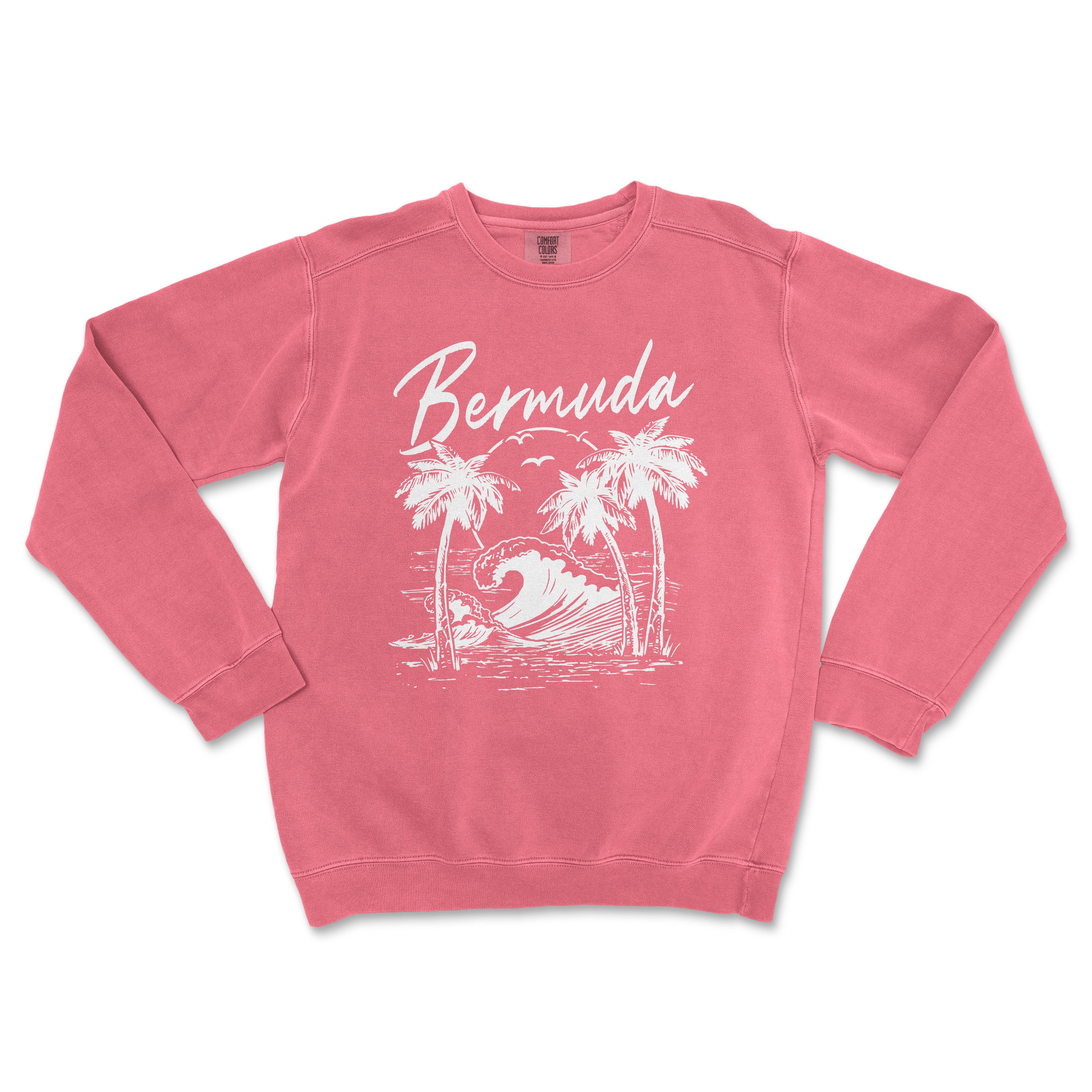 a pink sweatshirt with a picture of a surfboarder and palm trees