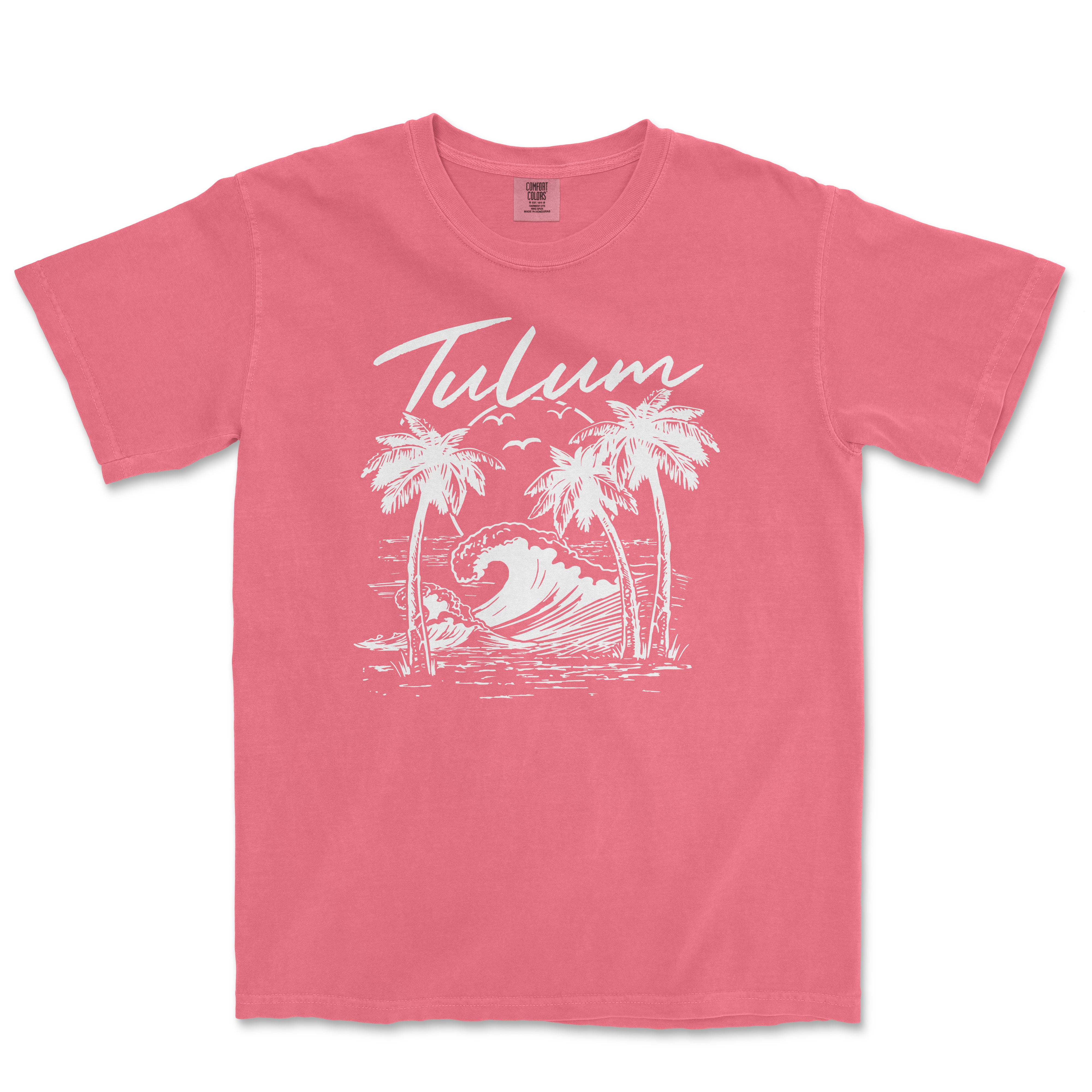 a pink t - shirt with a palm tree and a wave