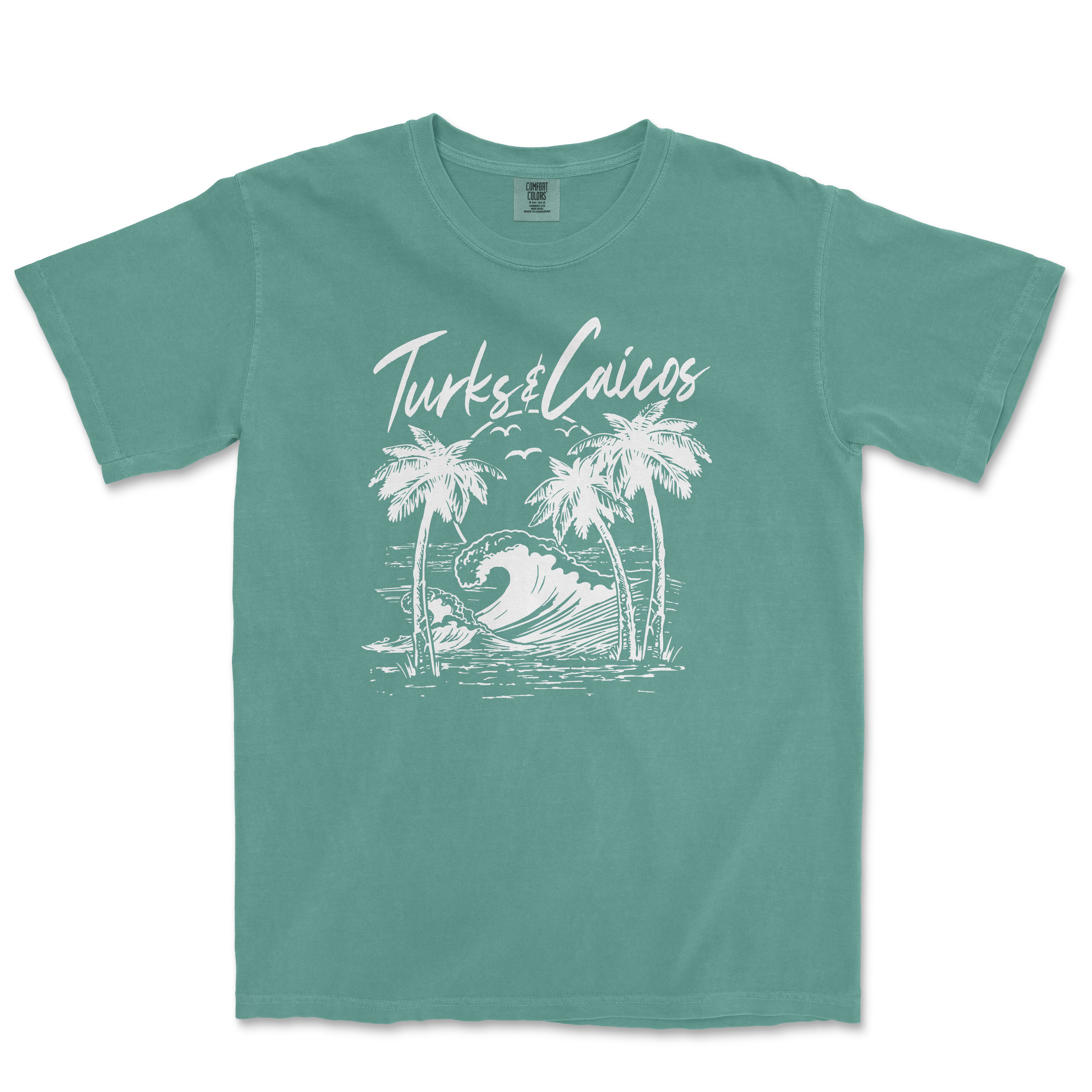 a green t - shirt with a picture of a wave and palm trees