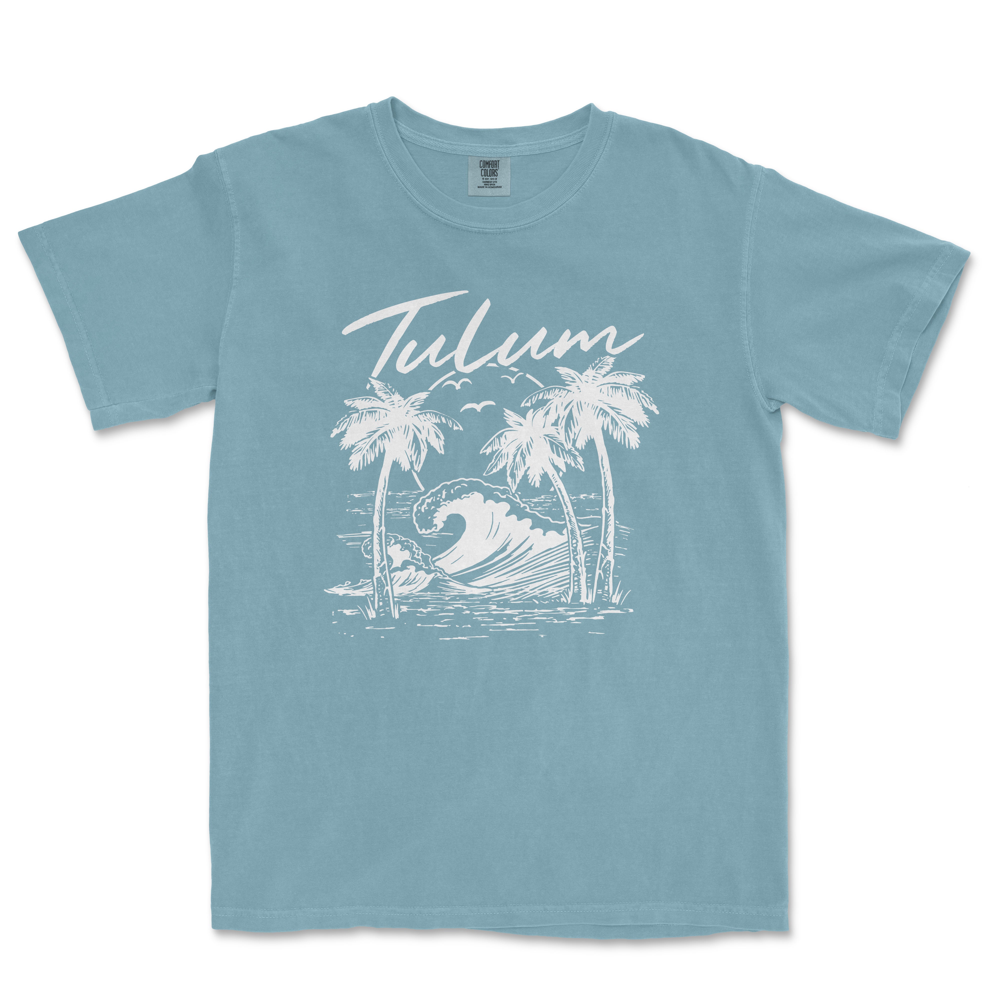 a blue t - shirt with a picture of a wave and palm trees