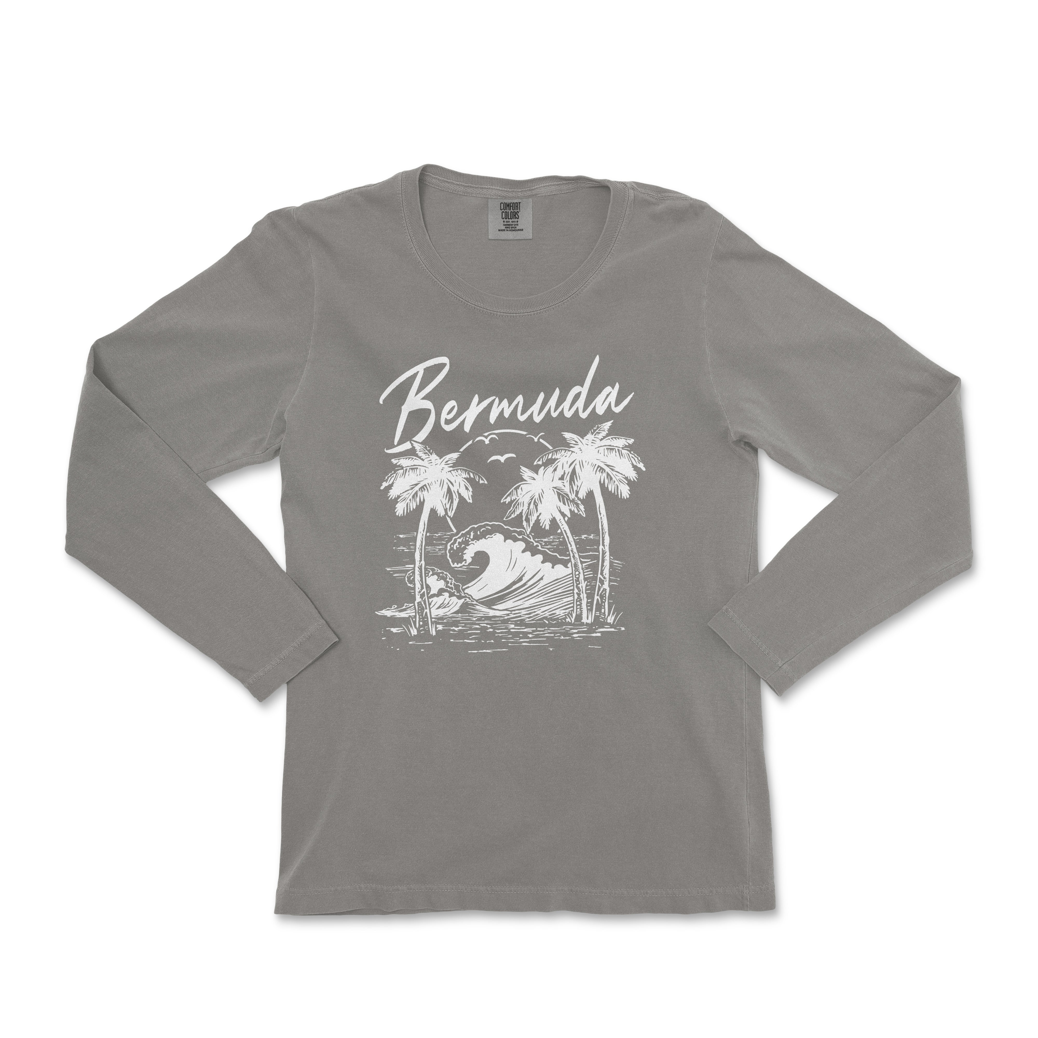 a women's long sleeve shirt with a graphic of a surfer and palm trees