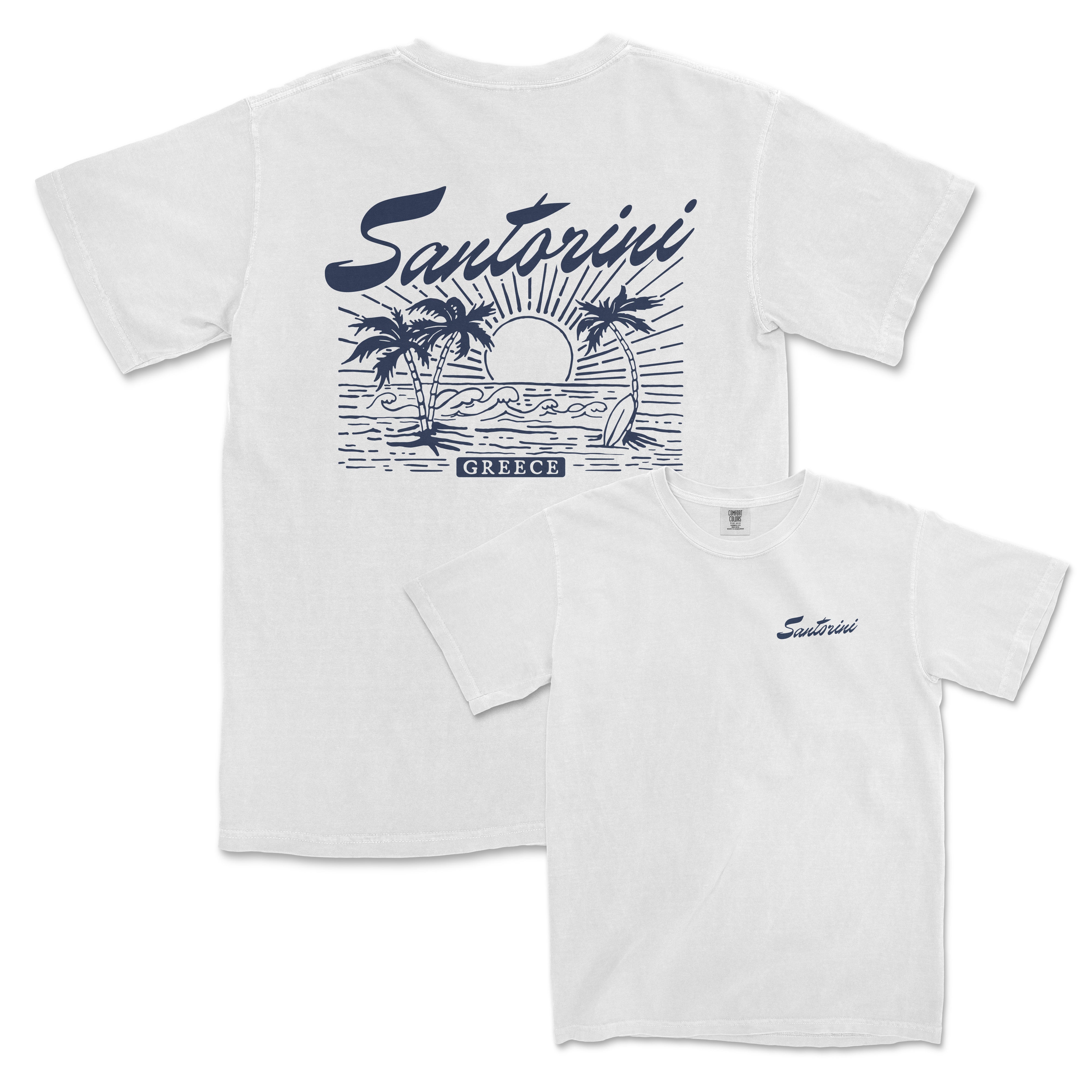 a white t - shirt with a picture of a sunset and palm trees