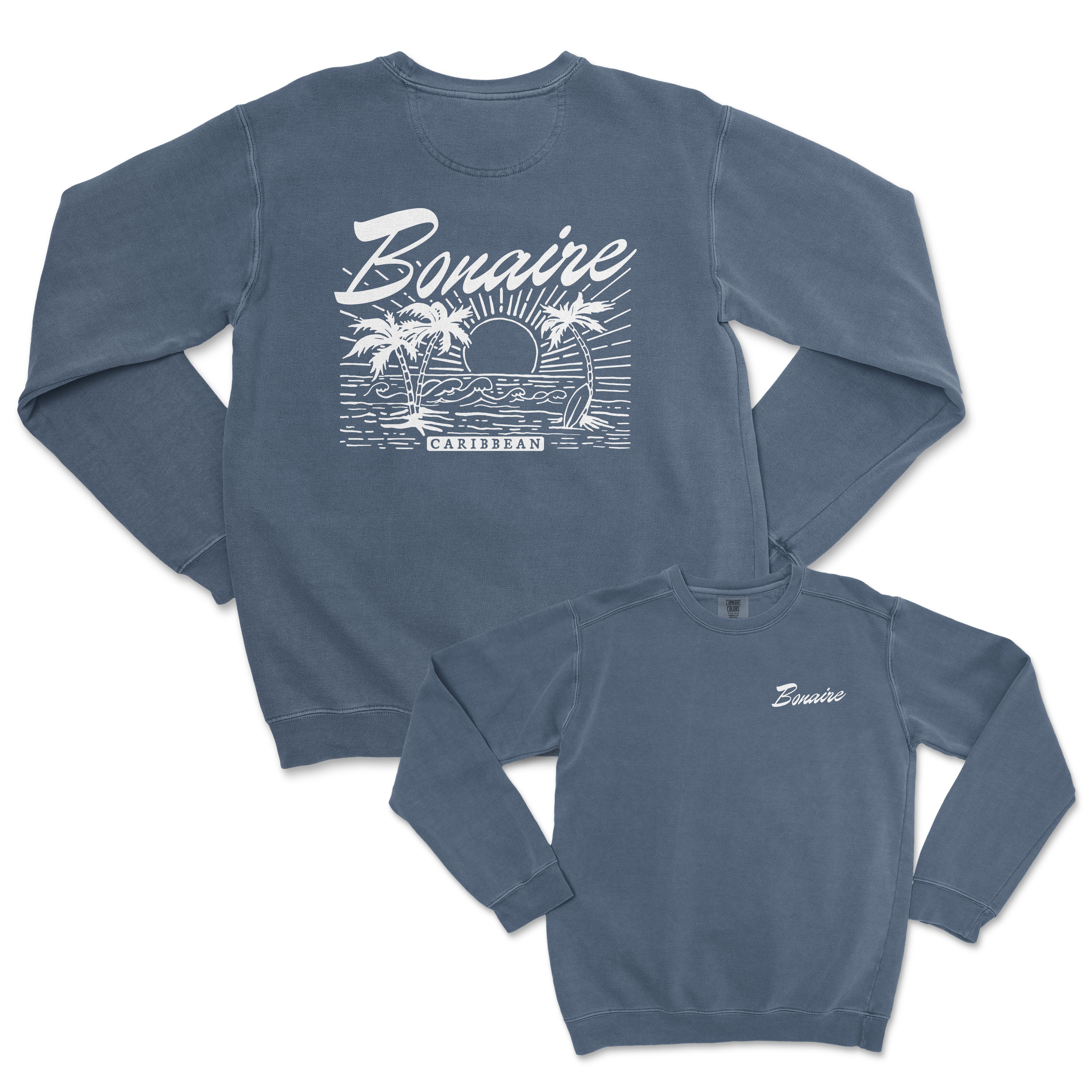 a blue sweatshirt with a picture of a boat and palm trees