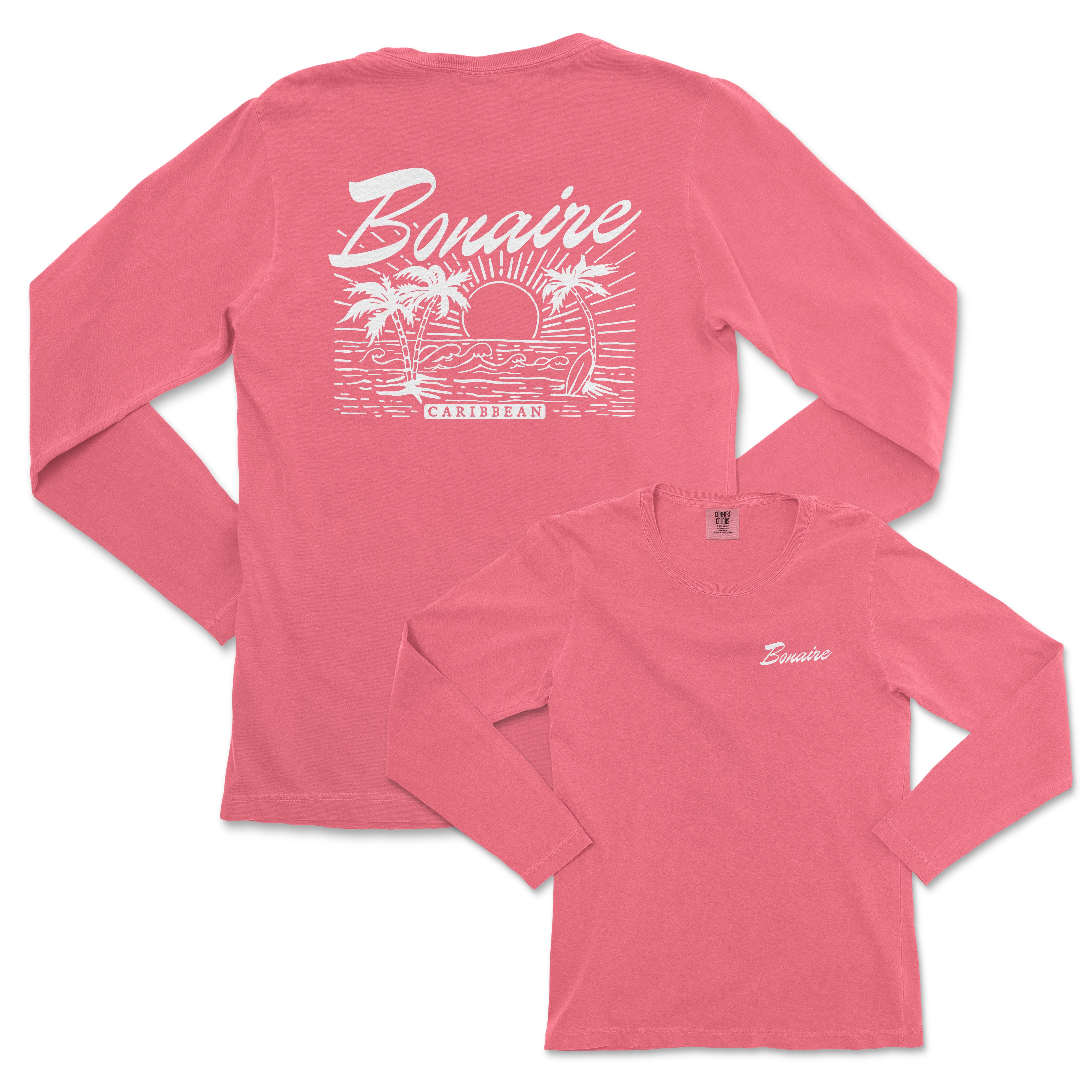 a women's pink long sleeve shirt with a sunset scene